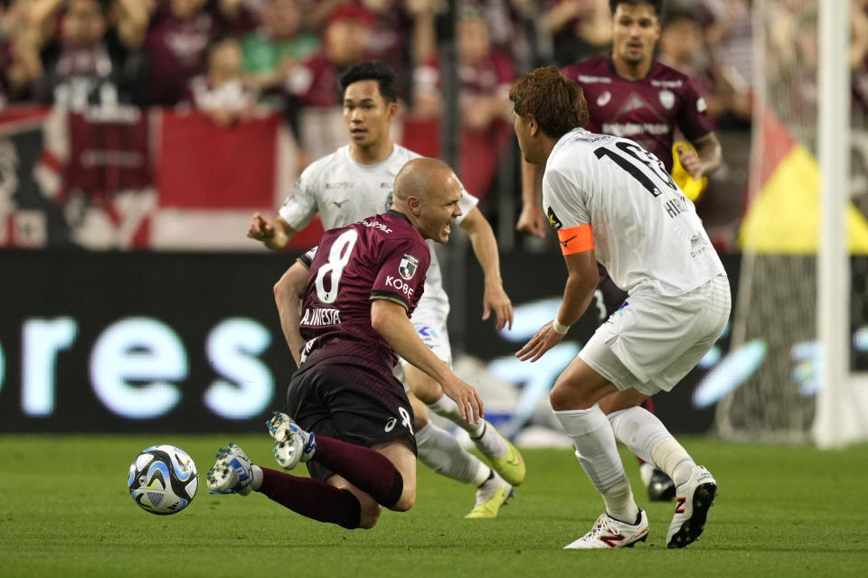 Vissel Kobe midfielder Andres Iniesta (8) reacts in a play during the first half of a friendly soccer match against Consadole Sapporo in Kobe, Japan, Saturday, July 1, 2023. The 39-year-old Spanish footballer plays his last match for the Japanese club Saturday. (AP Photo/Hiro Komae)