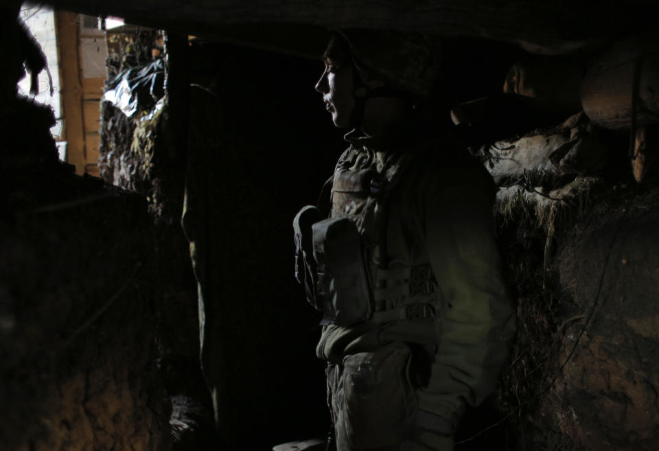In this photo taken on Monday, Nov. 18, 2019, a Ukrainian soldier in a trench in the front line in a destroyed coal mine Butovka near the town of Avdiivka in the Donetsk region, Ukraine. U.S.-made X-ray equipment, helmets and missiles make a difference for Ukrainian troops fighting Kremlin-backed separatists on the front line of the 21st century standoff between Russia and the West. So when President Donald Trump froze $400 million in U.S. military aid to Ukraine, allegedly to pressure the country’s leader for personal political favors, Ukrainians got nervous. (AP Photo/Vitali Komar)