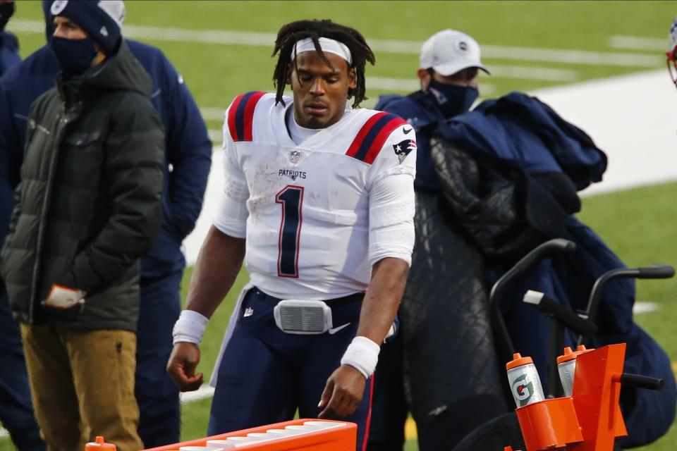 New England Patriots quarterback Cam Newton (1) reacts after fumbling the ball during the second half of an NFL football game against the Buffalo Bills Sunday, Nov. 1, 2020, in Orchard Park, N.Y. The Bills won 24-21. (AP Photo/John Munson)