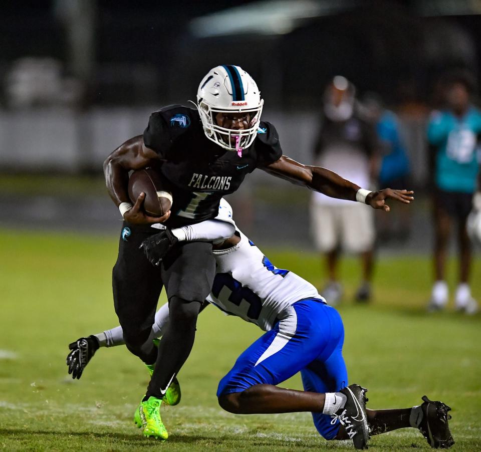 Jensen Beach running back Dennis Palmer Jr. (1) runs the ball during a high school football game against Wellington on Friday Sept. 8, 2023. 