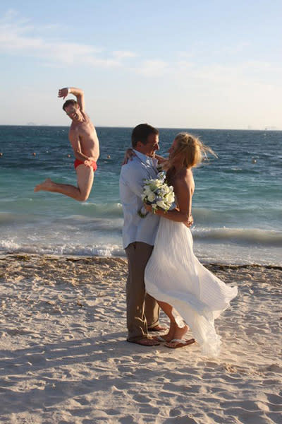 <div class="caption-credit">Photo by: Jennifer C. on EllenTV</div><div class="caption-title">Speedo Scene</div><p> Someone's really amped that this couple chose to have a destination wedding. </p> <p> <i>Have a photobomb of your own that you'd like to share? Upload your pic to</i> <i><span>BG's Facebook page</span> or</i><i><span>submit it to us via Instagram</span> (be sure to include the hashtag #bgphotobombs) and we may add it to our list!</i> </p>