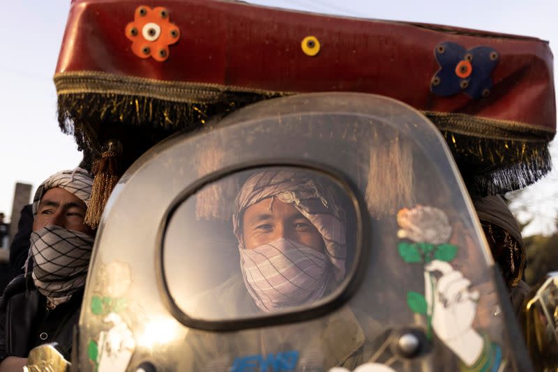 A man rides a rickshaw in Kabul