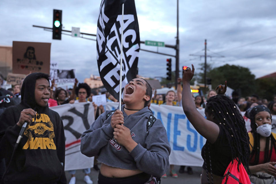 <p>Supporters of Philando Castile hold signs as they march along University Avenue in St. Paul, Minn., leaving a vigil at the state Capitol on Friday, June 16, 2017. St. Anthony police Officer Jeronimo Yanez was cleared of all charges in the fatal shooting last year of Castile. (Anthony Souffle/Star Tribune via AP) </p>