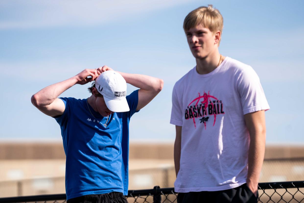 Ankeny's Devon Akers and Tyler Sickerson participate in track practice April 17 at Ankeny High School.