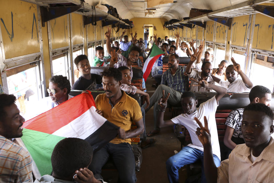 Sudanese pro-democracy supporters celebrate a final power-sharing agreement with the ruling military council Saturday, Aug 17, 2019, in the capital, Khartoum. The deal paves the way for a transition to civilian-led government following the overthrow of President Omar al-Bashir in April. (AP Photo)