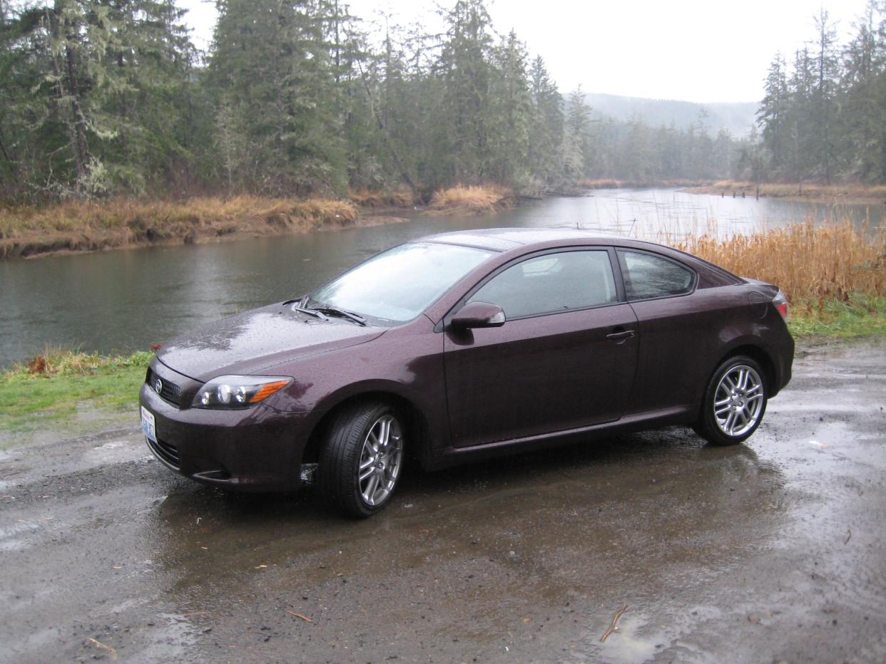 2008 Scion tC parked by the East Hoquiam River on a rainy autumn day.