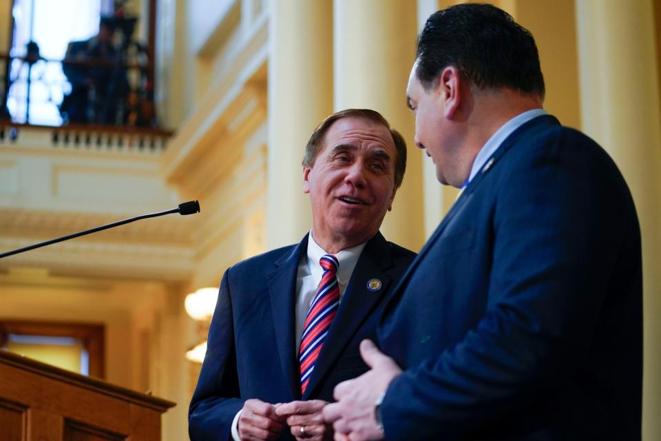 Assembly Speaker Craig Coughlin, left, and Senate President Nick Scutari speak on the floor before Gov. Phil Murphy (not pictured) delivers the budget address in the assembly chambers of the New Jersey Statehouse on Tuesday, Feb. 28, 2023.