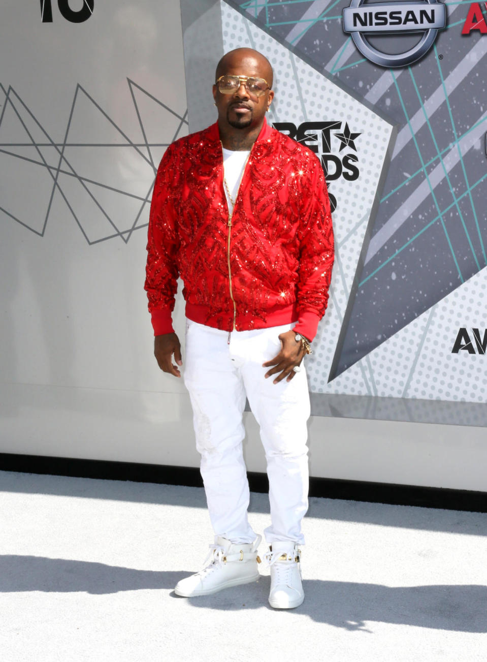 Jermaine Dupri in a red sequin bomber jacket and white jeans 