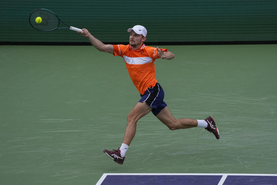 David Goffin, of Belgium, hits a return to Andy Murray, of Britain, during their match at the BNP Paribas Open tennis tournament Wednesday, March 6, 2024, in Indian Wells, Calif. (AP Photo/Mark J. Terrill)