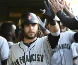 May 26, 2018; Chicago, IL, USA; San Francisco Giants shortstop Brandon Crawford (35) celebrates in the dugout after his two-run home run against the Chicago Cubs in the fourth inning at Wrigley Field. Mandatory Credit: Matt Marton-USA TODAY Sports