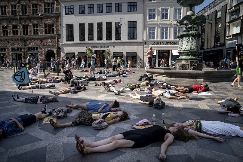 Extinction Rebellion Copenhagen perform a symbolic "mass death" on a street in Copenhagen, June 2020.