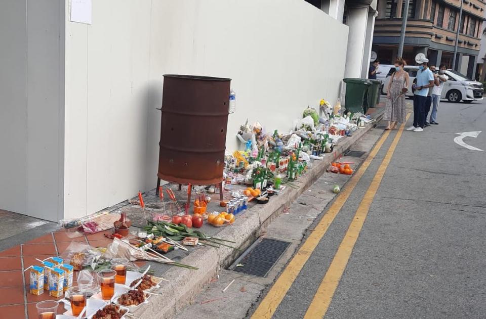 Offerings left at the site of the Tanjong Pagar Road car crash on 13 February that claimed the lives of five people. (PHOTO: Wan Ting Koh / Yahoo News Singapore)