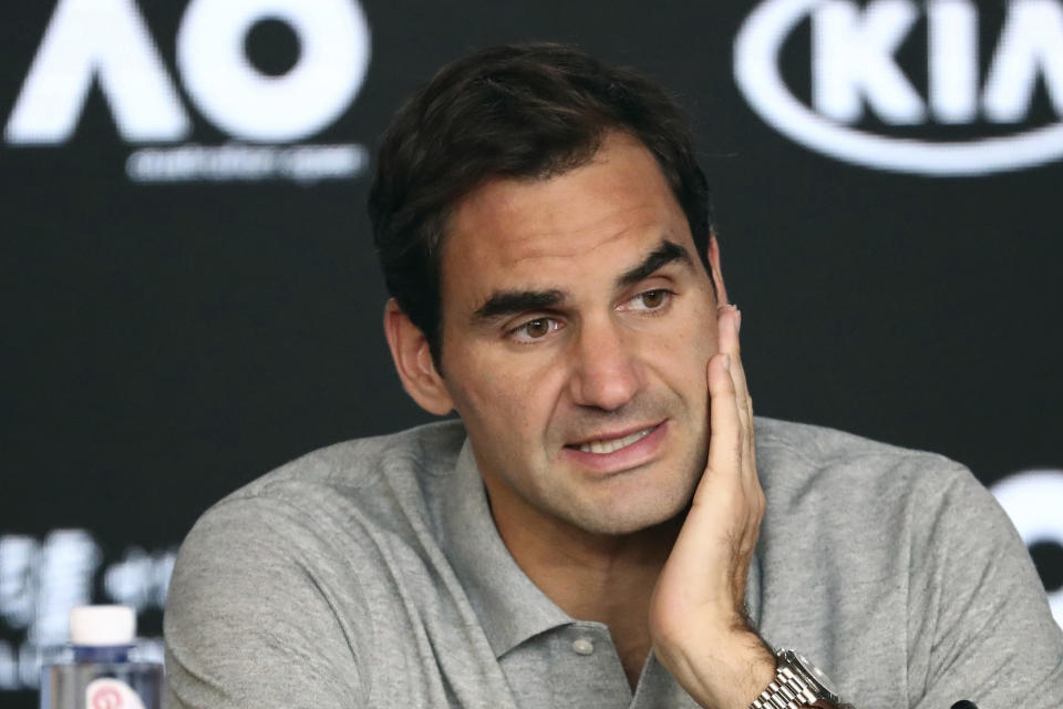 FILE - In this Jan. 30, 2020, file photo, Switzerland's Roger Federer speaks during a press conference following his semifinal loss to Serbia's Novak Djokovic at the Australian Open tennis championship in Melbourne, Australia. Federer is withdrawing from this month's Miami Open so he can spend extra time preparing to “work his way back out on tour,” his agent told The Associated Press on Monday, March 1, 2021. (AP Photo/Dita Alangkara, File)