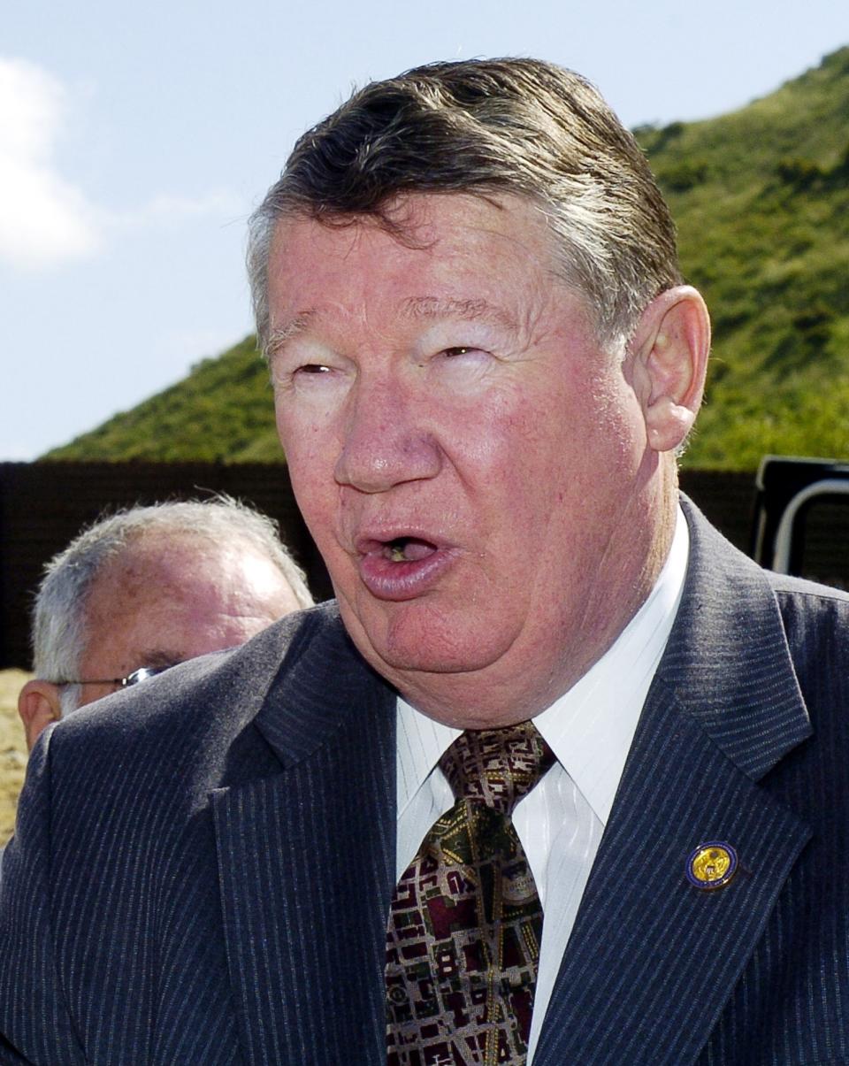 FILE - In this March 29, 2005, file photo, is then-Rep. Randy "Duke" Cunningham, R-Calif., speaking during a news conference in San Diego. When Rep. Cunningham admitted in 2005 to accepting $2.4 million in illegal gifts from defense contractors in exchange for government contracts and other favors, it was considered the largest bribery scandal in congressional history. The disgraced former San Diego congressman received one of the pardons issued Wednesday, Jan. 20, 2021, by President Donald Trump in the final hours of his term. (AP Photo/Denis Poroy, file)