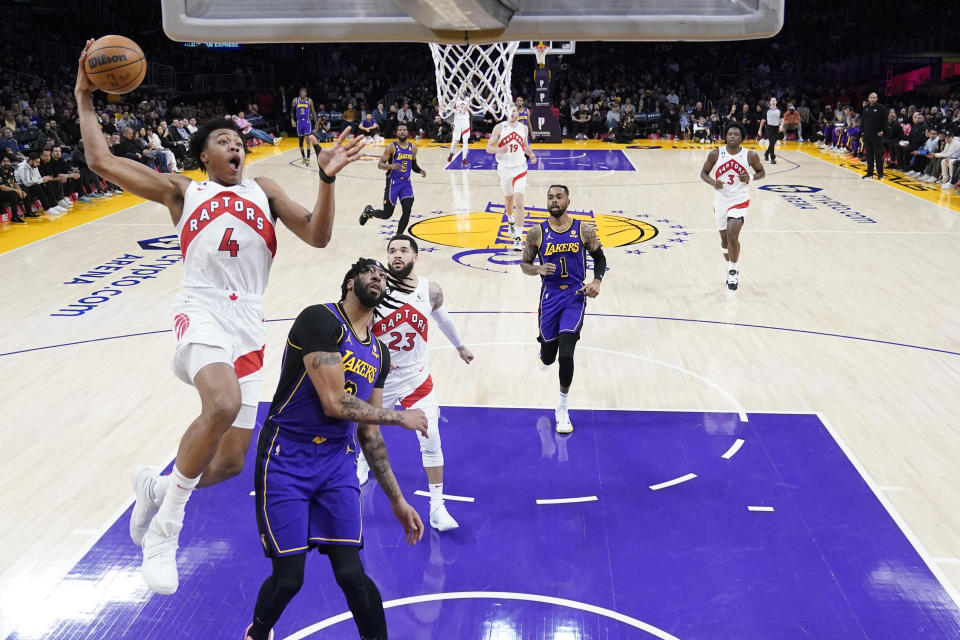 Toronto Raptors forward Scottie Barnes (4) shoots over Los Angeles Lakers forward Anthony Davis during the first half of an NBA basketball game Friday, March 10, 2023, in Los Angeles. (AP Photo/Marcio Jose Sanchez)