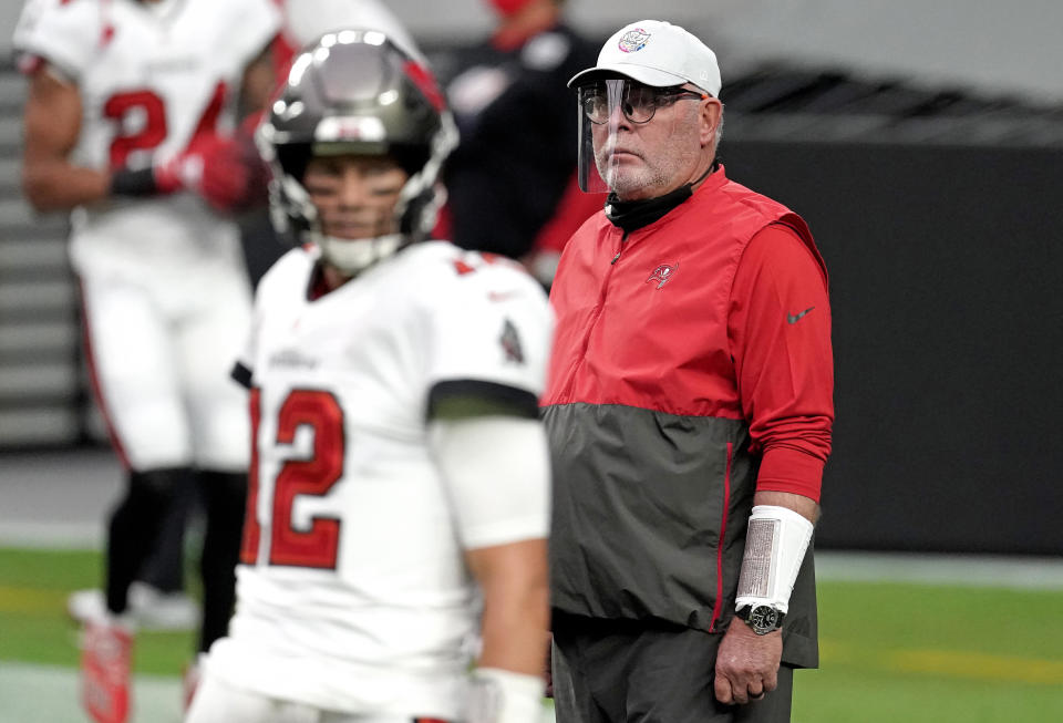 Tampa Bay Buccaneers head coach Bruce Arians (right) looks on as quarterback Tom Brady (left) warms up before a game Las Vegas Raiders at Allegiant Stadium. Mandatory Credit: Kirby Lee-USA TODAY Sports