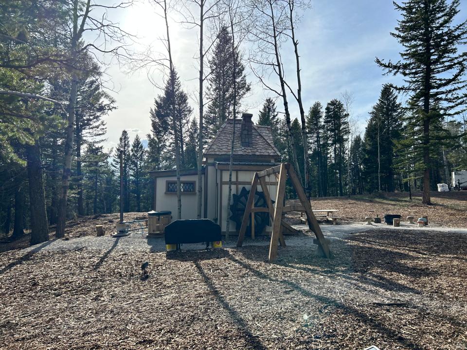 side of belle's cottage with swing