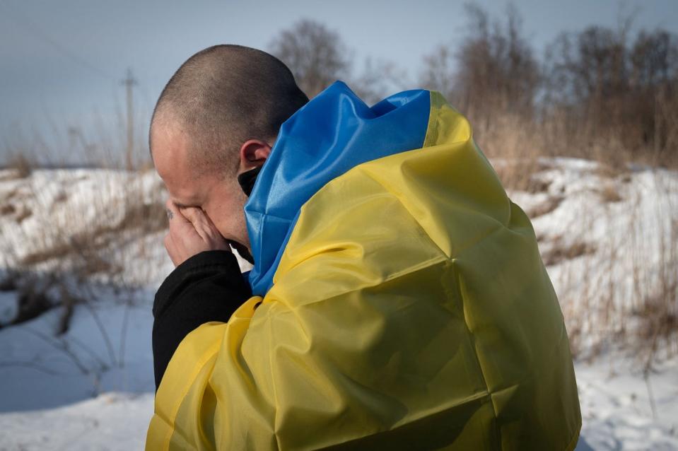 A Ukrainian prisoner of war (POWs) reacts after a swap, amid Russia’s attack on Ukraine, at an unknown location in Ukraine (via REUTERS)
