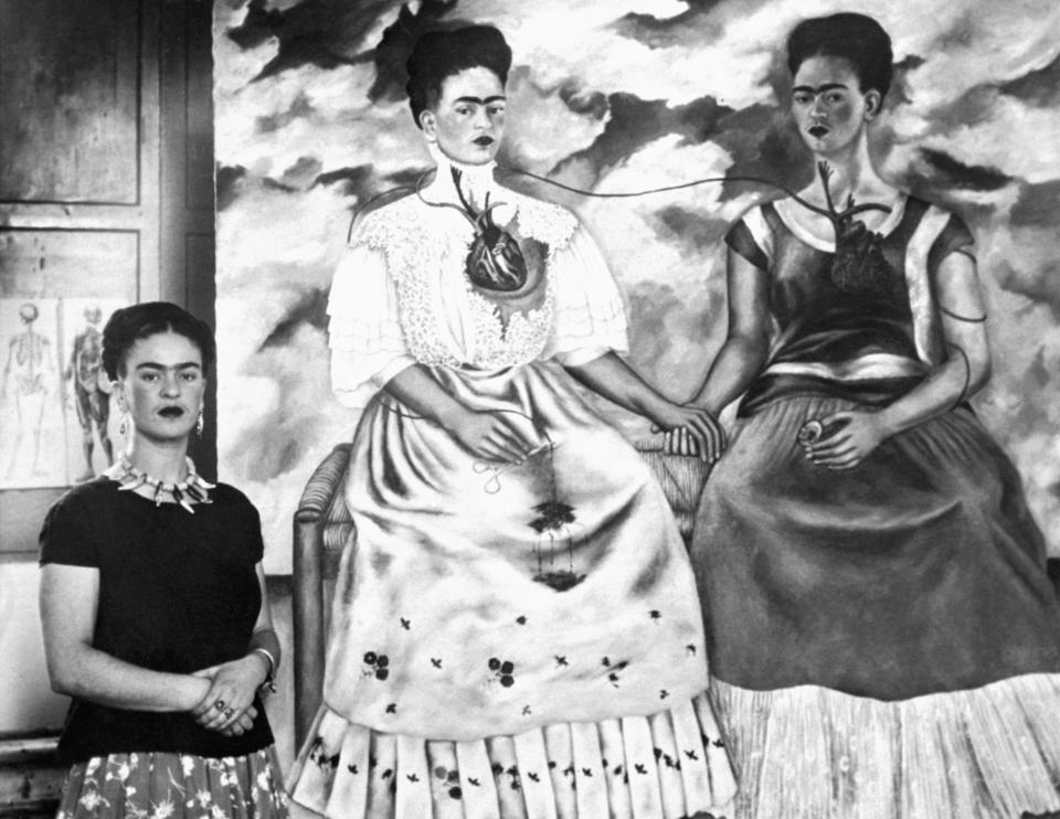 Kahlo with 1939 painting "The Two Fridas."