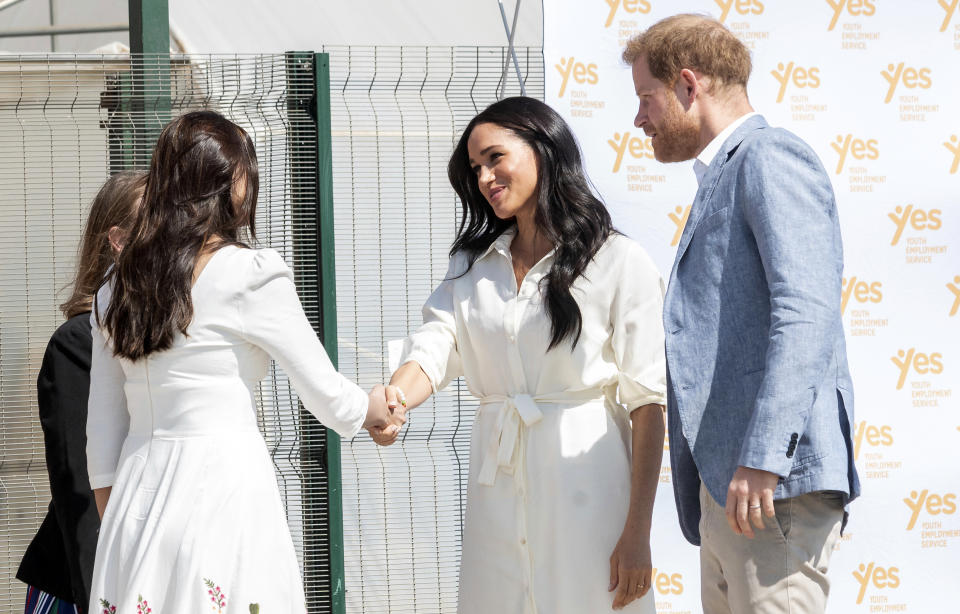 Britain's Prince Harry and Meghan, Duchess of Sussex visit a Youth Employment Services Hub in Makhulong, Tembisa, a township near Johannesburg, South Africa, Wednesday Oct. 2, 2019. The royal couple are on the last of their 10 day Africa tour. (AP Photo/Christiaan Kotze)