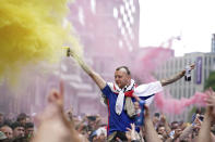 An England fan reacts as crowds gather outside the ground, ahead of the Euro 2020 soccer championship final match between England and Italy, at Wembley Stadium, in London, Sunday, July 11, 2021. (Zac Goodwin/PA via AP)