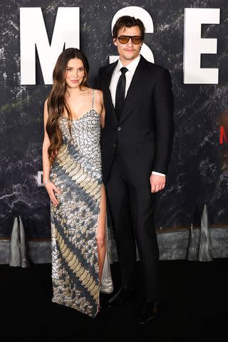 <p>CHARLY TRIBALLEAU/AFP via Getty</p> Millie Bobby Brown and Jake Bongiovi; March 2024