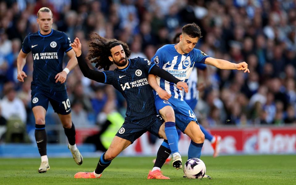 Facundo Buonanotte of Brighton & Hove Albion is challenged by Marc Cucurella of Chelsea during the Premier League match between Brighton & Hove Albion and Chelsea FC at American Express Community Stadium on May 15, 2024 in Brighton, England