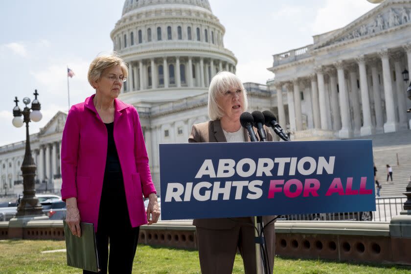 Sen. Elizabeth Warren, D-Mass., left, and Sen. Patty Murray, D-Wash., talk to reporters as the Supreme Court is poised to possibly overturn Roe v. Wade and urge President Joe Biden to use his executive authority to protect abortion rights, at the Capitol in Washington, Wednesday, June 15, 2022. (AP Photo/J. Scott Applewhite)