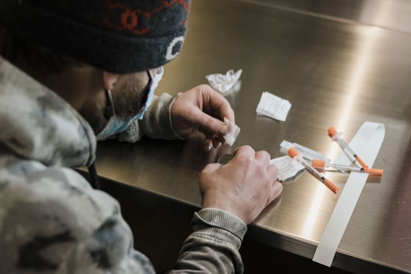 NEW YORK, NY - JANUARY 24: A man utilizes the narcotic consumption booths at a safe injection site at OnPoint NYC on Monday, Jan. 24, 2022 in New York, NY. In 2021, New York City opened two supervised drug injection sites in the Harlem and Washington Heights neighborhoods in an effort to address the increase in overdose deaths. (Kent Nishimura / Los Angeles Times)