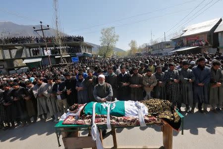 People offer funeral prayers for Umar Farooq, a civilian who was killed on Sunday during a protest against by-polls, in Barsoo village in Ganderbal district in Kashmir April 10, 2017. REUTERS/Danish Ismail