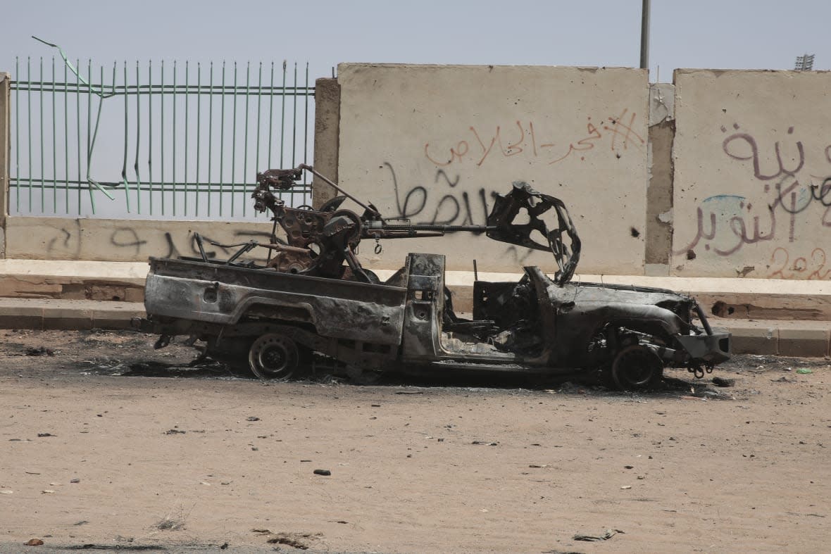 A destroyed military vehicle is seen in southern in Khartoum, Sudan, Thursday, April 20, 2023. (AP Photo/Marwan Ali)