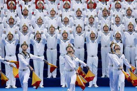 Chinese navy personnel perform at an event celebrating the 70th anniversary of the founding of the Chinese People's Liberation Army Navy (PLAN) in Qingdao, China, April 22, 2019. REUTERS/Jason Lee