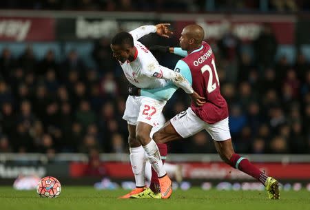 Football Soccer- West Ham United v Liverpool - FA Cup Fourth Round Replay - Upton Park - 9/2/16 Liverpool's Divock Origi in action with West Ham's Angelo Ogbonna Action Images via Reuters / Matthew Childs Livepic EDITORIAL USE ONLY.