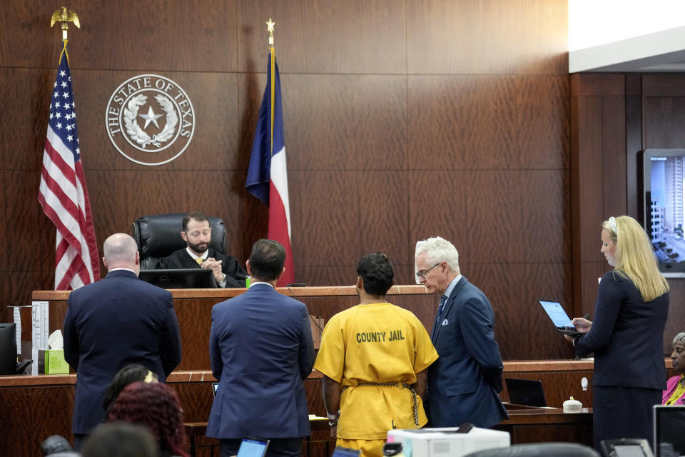 CORRECTS NAME: Prosecutor Megan Long, far right, reads the charges against Johan Jose Martinez-Rangel, one of the two men accused of killing 12-year-old Jocelyn Nungaray, in front of Judge Josh Hill on Tuesday, June 25, 2024, in Houston. Capital murder charges have been filed against Martinez-Rangel and Franklin Jose Pena Ramos, in the strangulation death of the 12-year-old. (Brett Coomer/Houston Chronicle via AP)