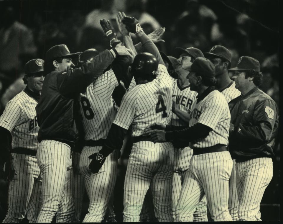 Above: Paul Molitor (4) joined his teammates in congratulating Rick Manning after Manning's game-winning hit gave the Milwaukee Brewers a 1-0 victory over the Cleveland Indians Wednesday.