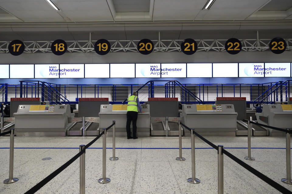 Empty check-in desks at the Thomas Cook section of Manchester Airport