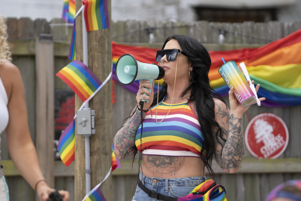 photo of cast member cuppie talking into a bullhorn on the set of tampa baes