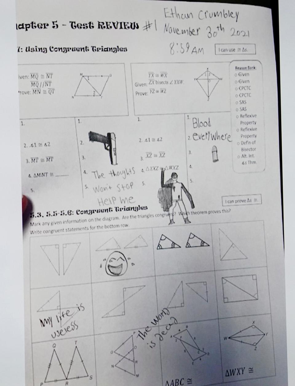 Assistant Oakland County Prosecutor Marc Keast presents a photo to the jury of the math test sheet drawn on by Ethan Crumbley before Ethan Crumbley's deadly mass shooting at Oxford High School in 2021 that killed four people and wounded seven others. His father James Crumbley is on trial in the Oakland County courtroom of Judge Cheryl Matthews on Thursday, March. 7, 2024. Crumbley is being tried on four counts of involuntary manslaughter for his son's shooting.