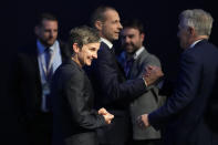 Former Wales international Laura McAllister smiles after she was elected to UEFA's executive committee at the end of the 47th ordinary UEFA congress in Lisbon, Wednesday, April 5, 2023. Background center is Aleksander Ceferin, president of UEFA. (AP Photo/Armando Franca)