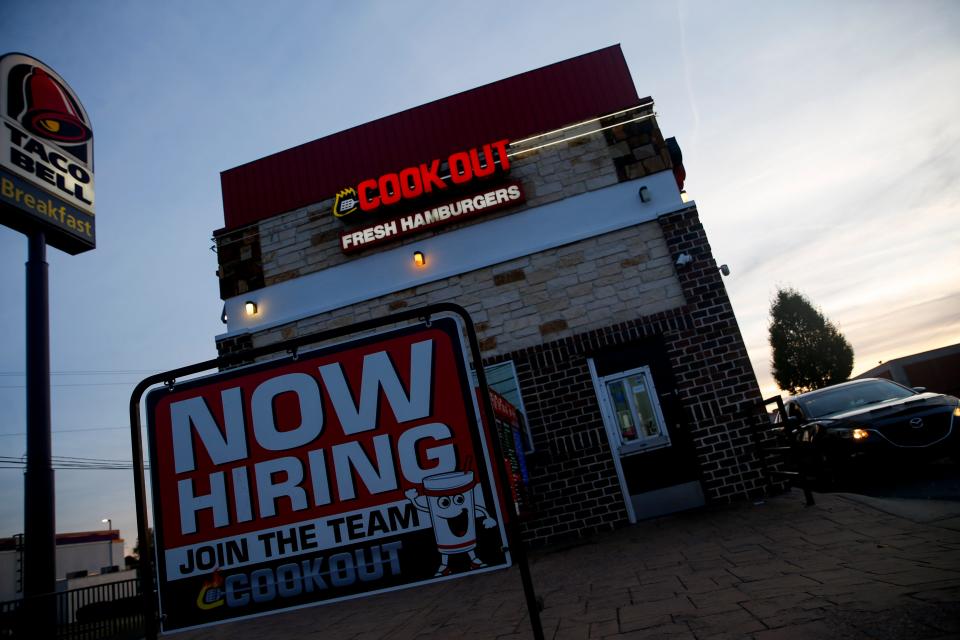 A sign in front of the restaurant lets people know of job opportunities at the Cook Out at the intersection of Providence and Riveride in Clarksville, Tenn., on Wednesday, Nov. 10, 2021. 