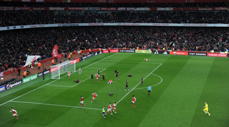 Arsenal players and staff celebrate on the pitch after Reiss Nelson scored their team's third goal during the Premier League match between Arsenal and AFC Bournemouth at the Emirates Stadium on 4 March, 2023 in London, United Kingdom.