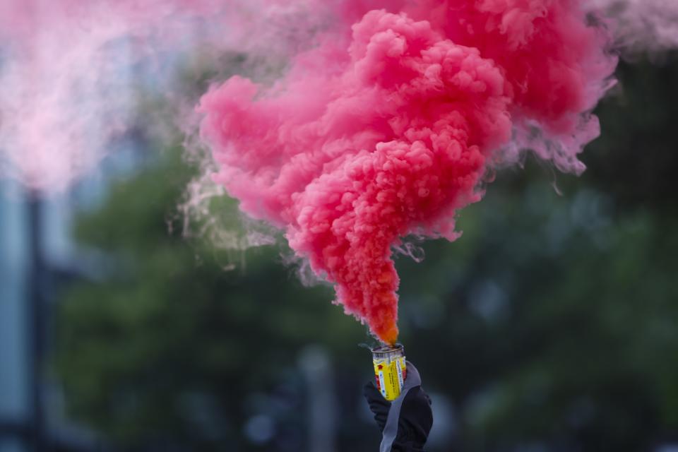 <p>An activist holds a smoke bomb during a protest during the G20 summit in Hamburg, Germany, July 7, 2017. (Photo: Hannibal Hanschke/Reuters) </p>