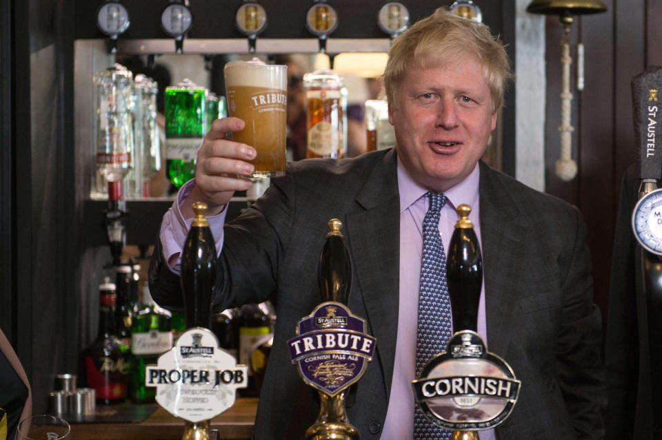 Former Mayor of London Boris Johnson drinks a pint of beer on a visit to the St Austell Brewery in Cornwall, during a Vote Leave campaign visit.