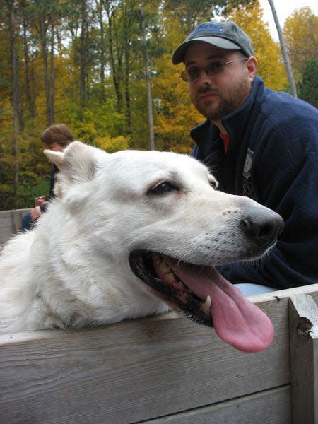 Dogs like Big Mike are invited for a hay ride at Bendix Woods County Park, as seen at a prior year’s ride. Photo provided