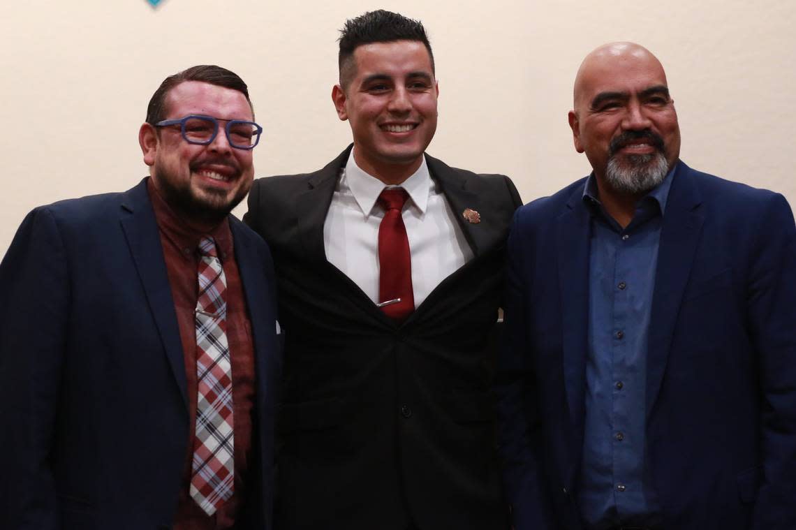 Visalia’s newly elected city council member Emmanuel Hernández Soto (center) with Eddie Valero, Tulare County Board of Supervisor (left) and José Sigala, Tulare City Council member (right) after taking oath Wednesday night (Dec. 7) during a special meeting.