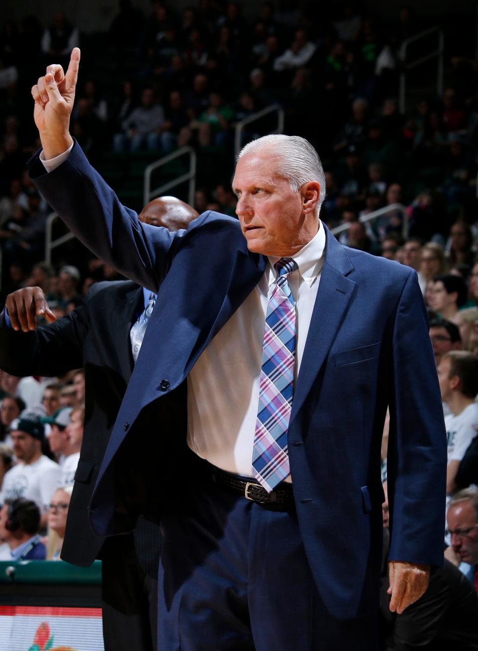 Former Youngstown State and Gannon coach Jerry Slocum signals during the first half of an NCAA college basketball game against Michigan State in 2016, in East Lansing, Mich. Slocum's son, Aaron Slocum, is slated to be the next McDowell football head coach.