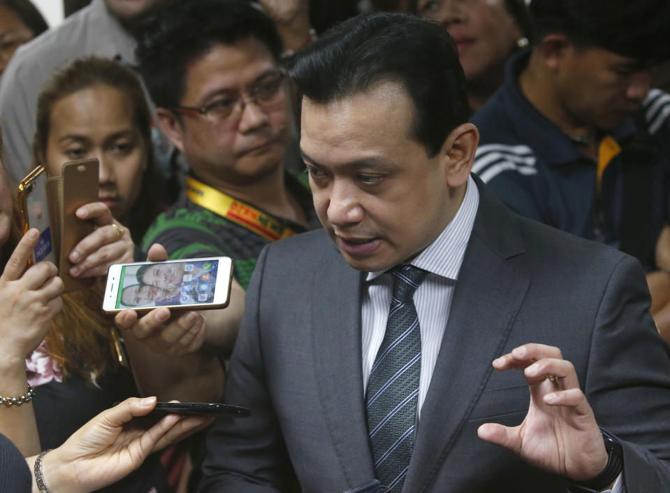 Philippine opposition Sen. Antonio Trillanes IV talks to the media outside his office in the Philippine Senate following a regional trial court order for his arrest Tuesday, Sept. 25, 2018 in suburban Pasay city, south of Manila, Philippines. Trillanes who remained holed up in his office for three weeks now after President Rodrigo Duterte voided an amnesty given to the former rebel military officer, willingly went with police to post bail. (AP Photo/Bullit Marquez)