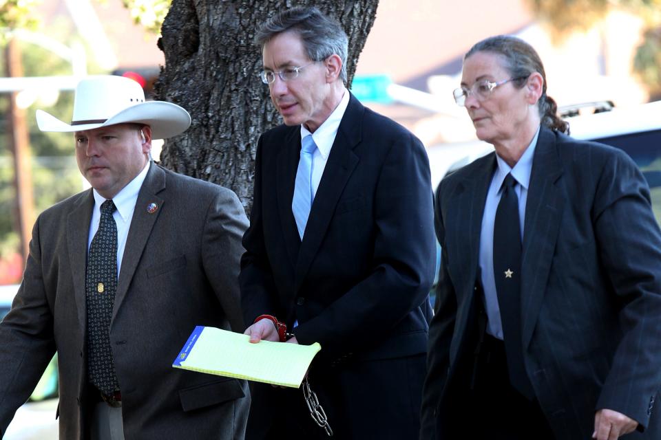 Warren Jeffs is taken into the side entrance of the Tom Green County Courthouse, Monday, Aug. 8, 2011, in San Angelo, Texas. Jeffs, prophet of the polygamy-sanctioning Fundamentalist Church of Jesus Christ of Latter Day Saints, was found guilty on two counts of sexual assault of a child and could face up to 119 years in prison.