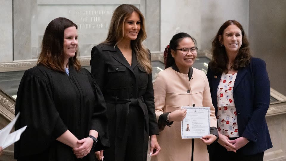 Melania Trump is seen alongside Judge Elizabeth Gunn, left, and US Archivist Colleen Shogan, far right, as they pose for photographs with a newly sworn-in citizen at the National Archives in Washington, DC, on December 15, 2023. - Saul Loeb/AFP/Getty Images