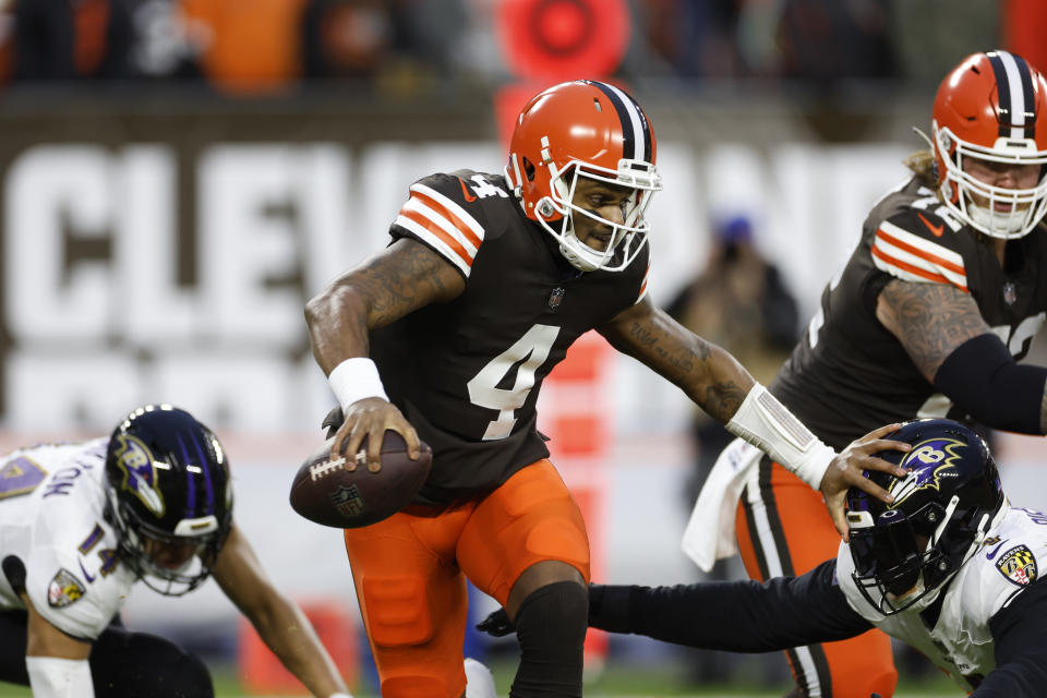 Cleveland Browns quarterback Deshaun Watson carries the ball during the first half of an NFL football game against the Baltimore Ravens, Saturday, Dec. 17, 2022, in Cleveland. (AP Photo/Ron Schwane)